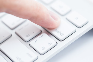 Man hand typing on keyboard