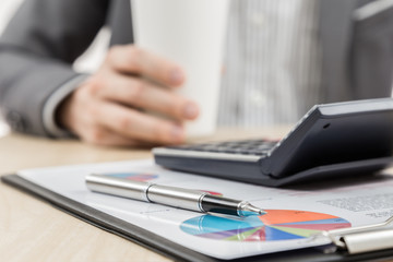 Businessman's hand showing financial report