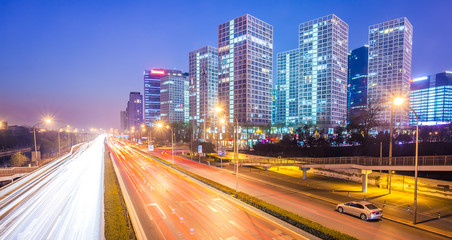 Fototapeta na wymiar light trails on the modern city at dusk in beijing,China