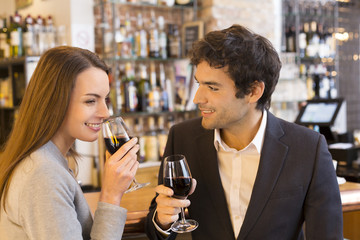 Loving couple takes a drink in restaurant