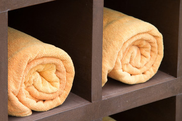 Rolled up orange spa towels