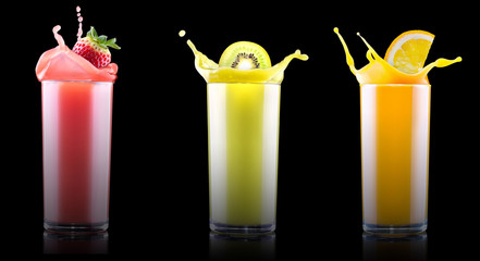 tasty summer fruit drinks in glass with splash