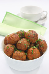 Fried pork meatballs in bowl