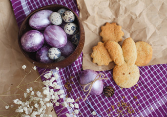 Bowl with Easter colored eggs and homemade cookies