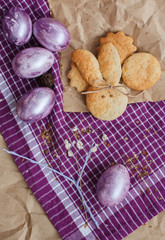 Bright set of Easter eggs and rabbit shape homemade cookie