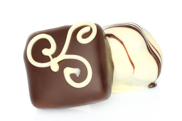Assorted chocolate candies on white background