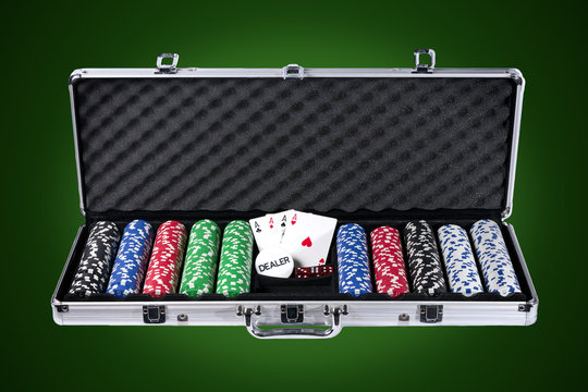 Poker case with chips and cards with path on green background
