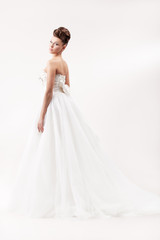 Fototapeta na wymiar gorgeous bride in long white luxury dress
