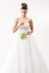gorgeous bride in long white luxury dress