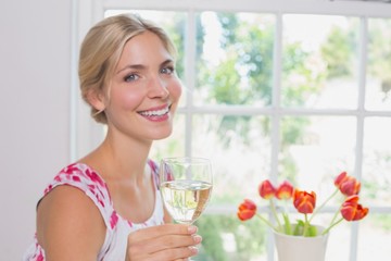 Portrait of a happy young woman with wine glass
