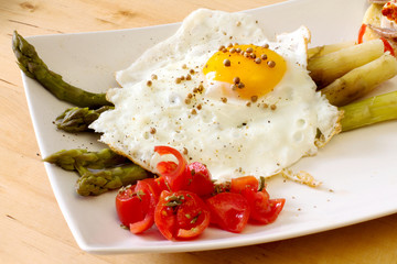 fried egg with steamed asparagus
