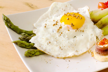 fried egg with steamed asparagus