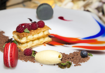 Fruit dessert decoration with fresh macarons - selective focus