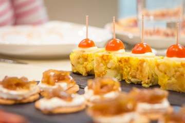 Spanish omelet tapas and cheese with onion pinchos
