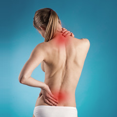 Woman suffering from lumbago or back pain - 62452951
