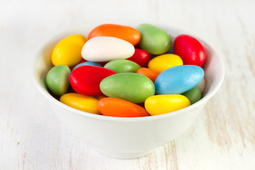 sweets in white bowl on white background