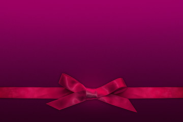 Pink ribbon on purple background