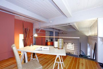 Reconstructed mezzanine office overlooking living room - obrazy, fototapety, plakaty