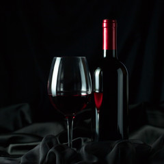 bottle and glass with red