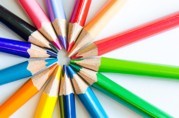 Close up detail of colorful pencils arranged in circle