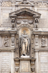 Medieval statue on the building in Milan