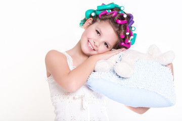 Obraz na płótnie Canvas Cute little girl in curlers and pajamas sleep bedtime