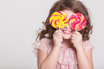 Funny child eat candy lollipop Funny baby girl eating sweets