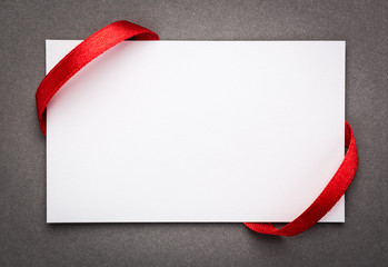 Card with red ribbons bows