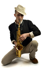 Obraz na płótnie Canvas young man playing saxophone