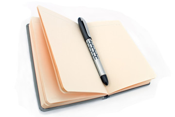 Notepad and pen isolated on white