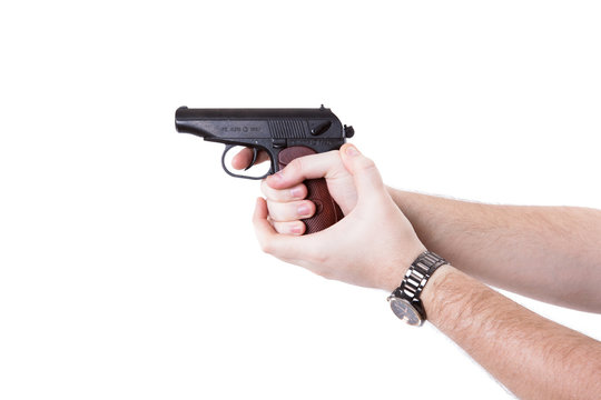 man's hand holding a pistol Makarov