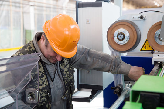 Serviceman during repairing modern industrial machine