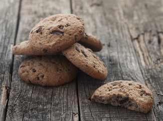 Oatmeal cookies with raisins on vintage wooden background