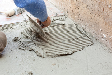 Tiler works with flooring