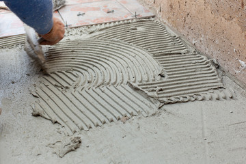 Tiler works with flooring