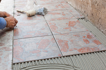 Tiler works with flooring