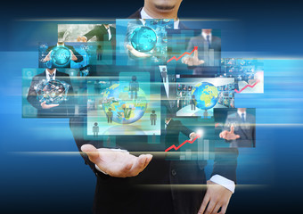 businessman holding Reaching images streaming in hands