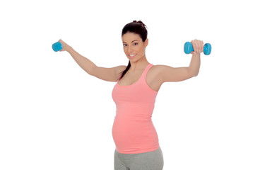 Pregnant woman doing exercise with dumbbells