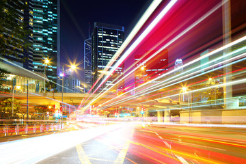 Fototapeta na wymiar Fast moving car light in city at night