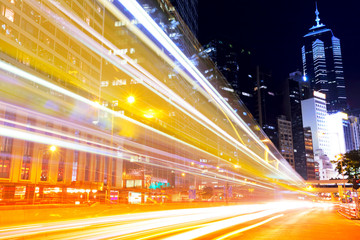 Fototapeta na wymiar Busy traffic in modern city at night