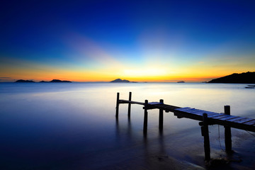 Sunset seascape with wooden pier