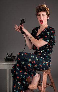 Pinup Girl in Flowered Outfit Shocked by Phone Information