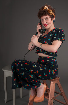 Pinup Girl in Flowered Outfit on The Phone