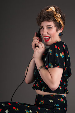 Pinup Girl in Flowered Grins with Phone