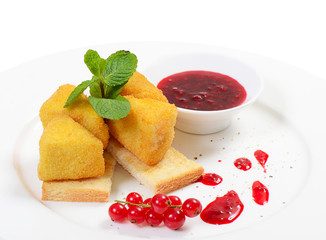 Cheese in breadcrumbs with currant jam