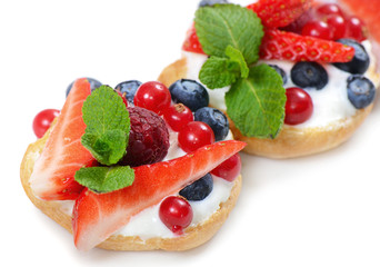 Profiteroles with berries currant , strawberries