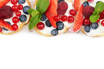 Profiteroles with berries currant , strawberries