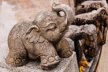 Fototapeta na wymiar Baby elephant statue at shrine