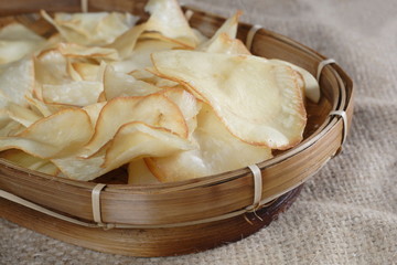 Fototapeta na wymiar Chips Cassava at natural sack cloth