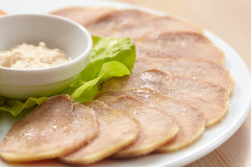 Slices of boiled beef tongue